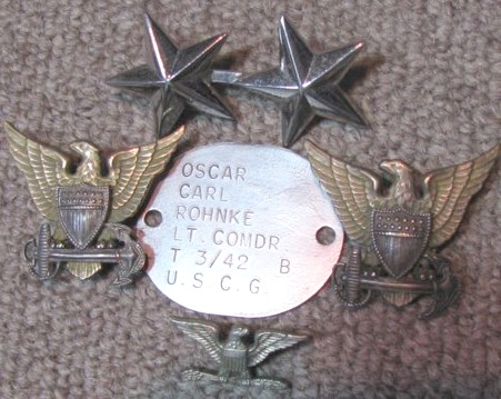 photograph of dogtag and various collar devices