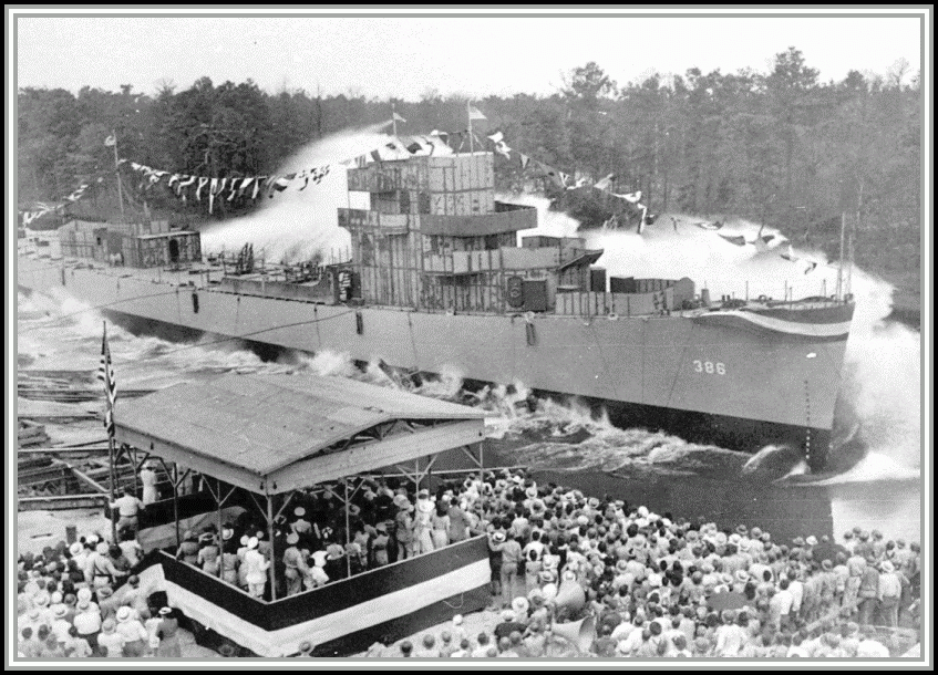 photograph of the USS SAVAGE (DE-386) as she gently glides into the water on launching day