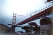 photograph of USS Savage passing under the Golden Gate Bridge