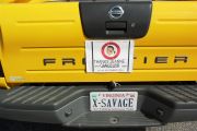 photograph showing "X-SAVAGE" license plate 