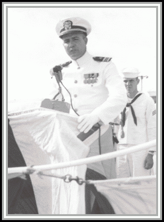 photograph of LCDR Robert C. Peniston, USN Assuming command of USS SAVAGE (DER-386) Pearl Harbor, Hawaii 10 December, 1959