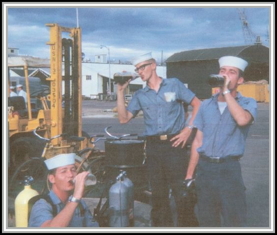 photograph of Rich Cornall (right) on pier with buddies