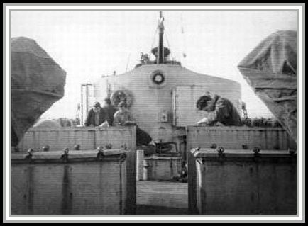 photograph showing several crewmembers reading on the fantail