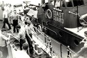 photograph of a Point Class Boat receiving replenishment supplies