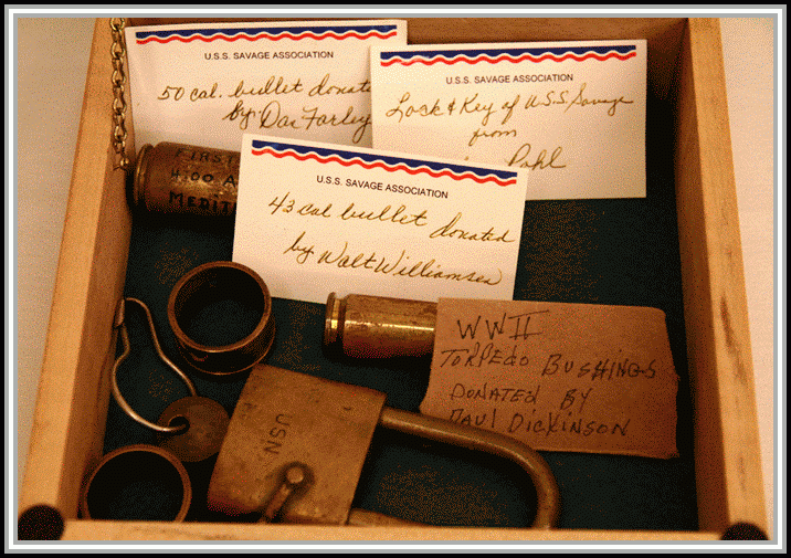 photograph of 50 cal. bullett, lock and key, 43 cal. bullett, WWII torpedo bushings