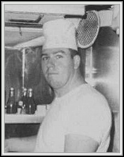 photograph of Joseph Allen at ship's stove