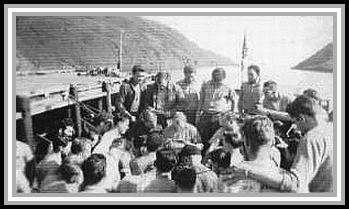 photograph of crew receiving mail on the fantail