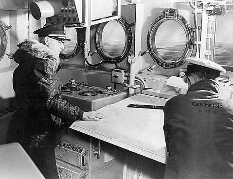 photograph of Captain Rohnke on the bridge of the icebreaker EASTWIND (W279)