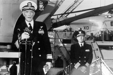 photograph of Admiral Richard E. Byrd speaking as Captain Rohnke looks on