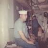 Goodheart, 1st class shipfitter (sitting), Toutchique, 2nd class electrician. Taken in the machine shop.