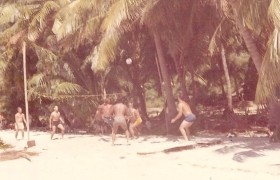 photograph of volleyball game on shore