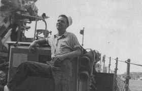 photograph of Ed Russell on the DER-386 deck, shakedown cruise to Guantanamo Bay 
