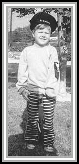 photograph of grandson Scott with QM1c stripes on his shirt